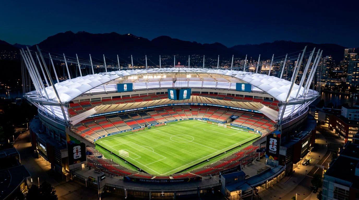 BC Place stadium in Vancouver at night with retractable roof open and pitch illuminated for a World Cup match